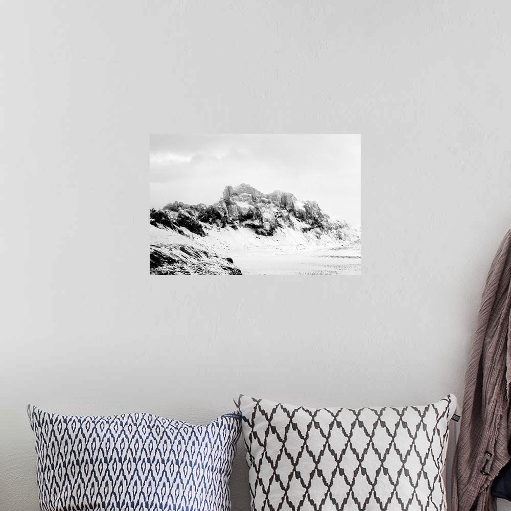 A bohemian room featuring A photograph of a rugged winter landscape.