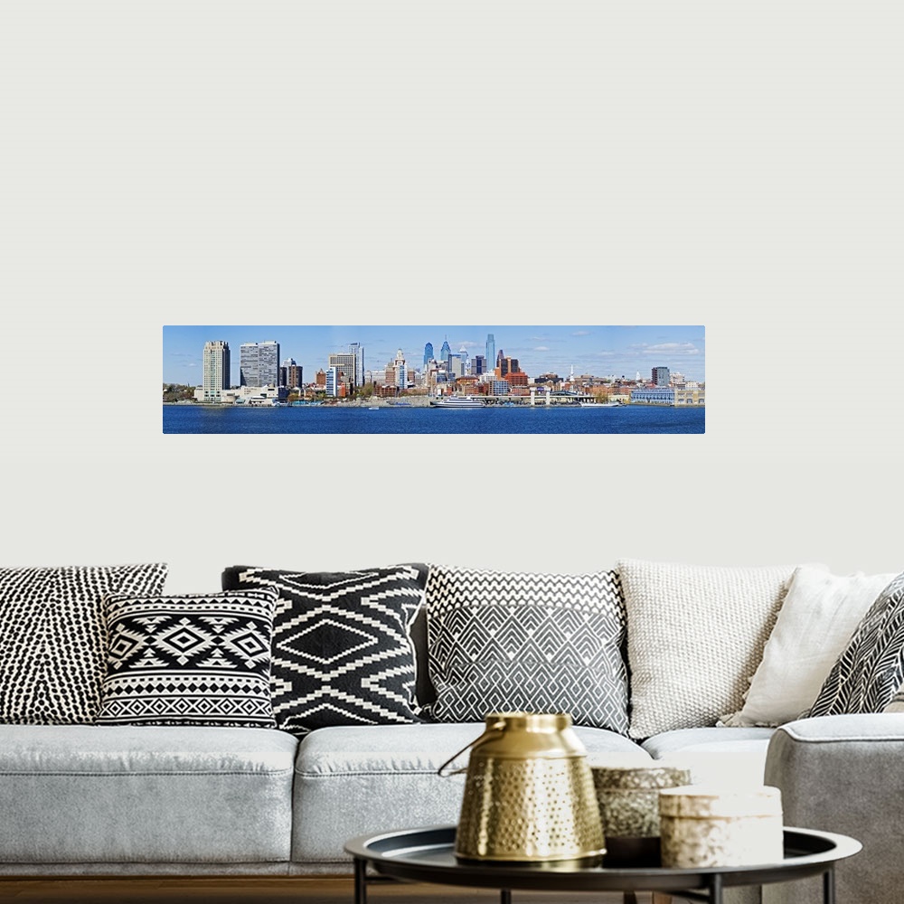 A bohemian room featuring A panoramic photograph taken of the Philadelphia skyline during the day from just across the Dela...