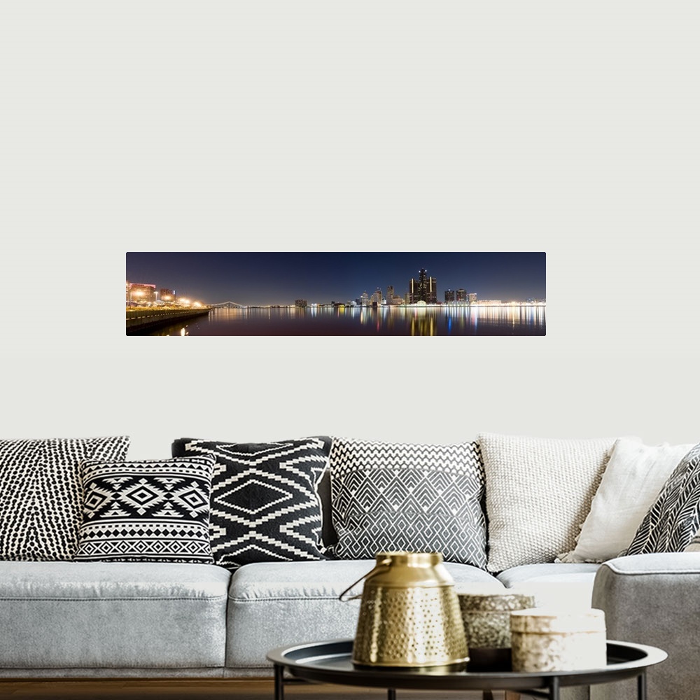 A bohemian room featuring Panoramic image of the Detroit skyline in the evening with the buildings and lights mirrored in t...