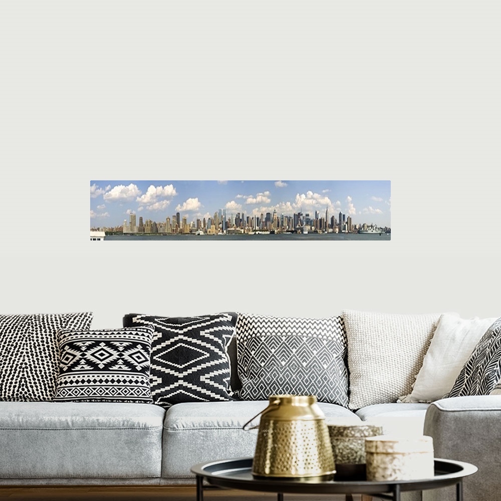 A bohemian room featuring Panoramic of the New York City Skyline on a bright sunny day.