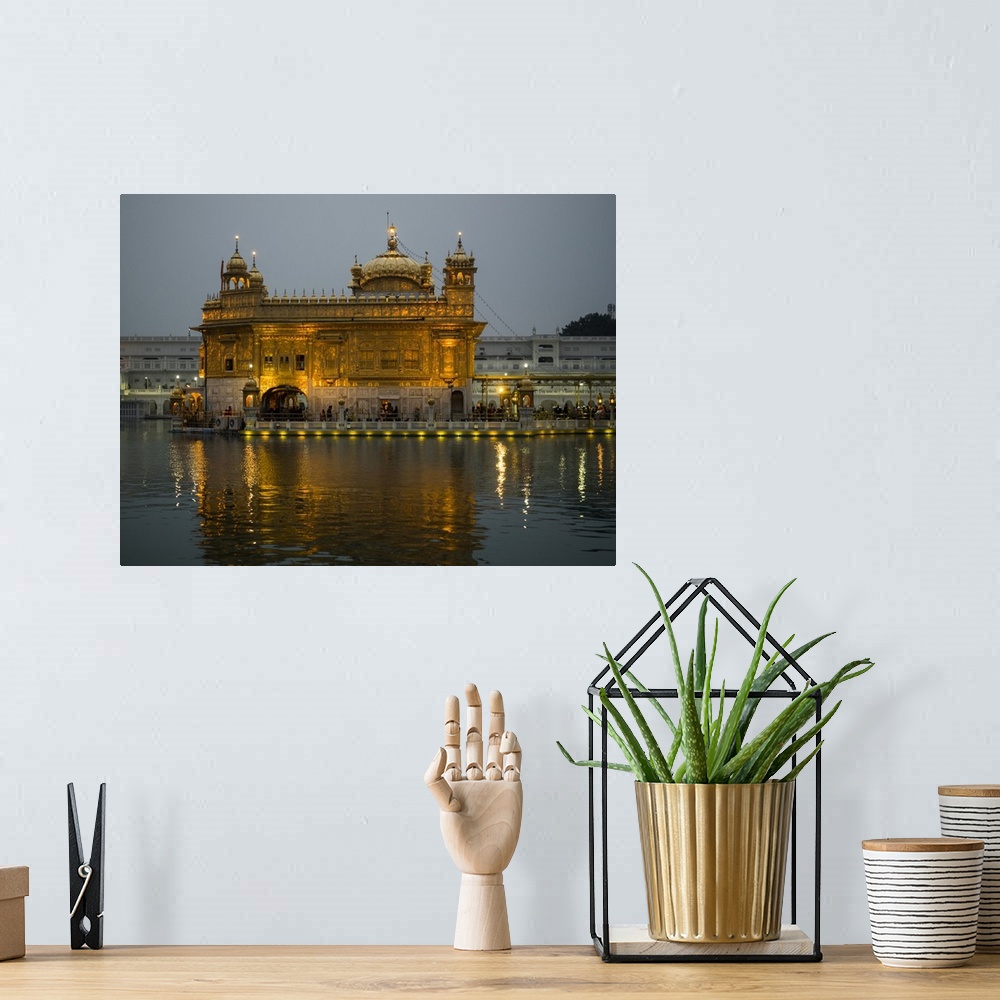 A bohemian room featuring Golden Temple reflected in pool, Amritsar, Punjab, India.