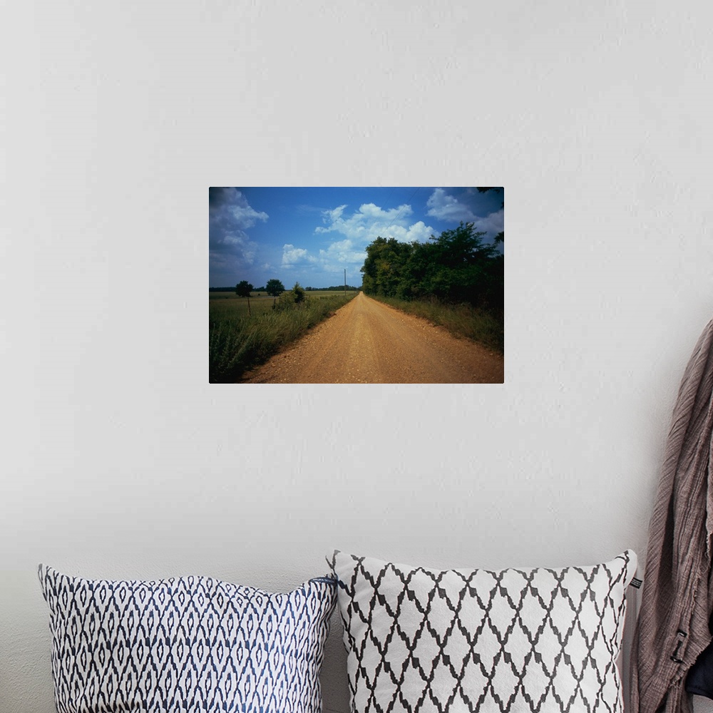 A bohemian room featuring Gravel road passing through a field, Arkansas