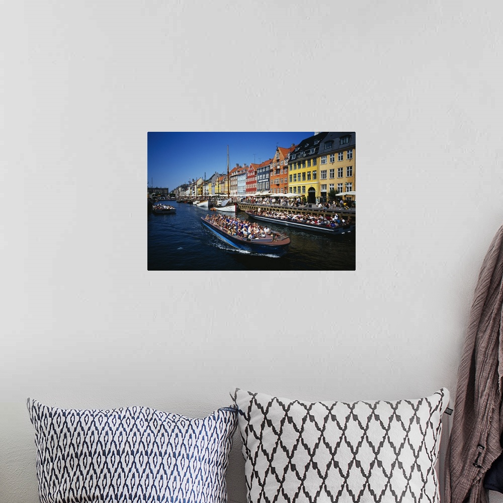 A bohemian room featuring High angle view of tourists on a boat in a river, Nyhavn, Copenhagen, Denmark