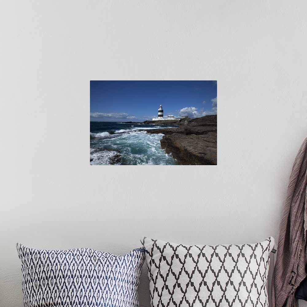 A bohemian room featuring Landscape photograph on a giant canvas of waves crashing into the rocky shoreline in County Wexfo...