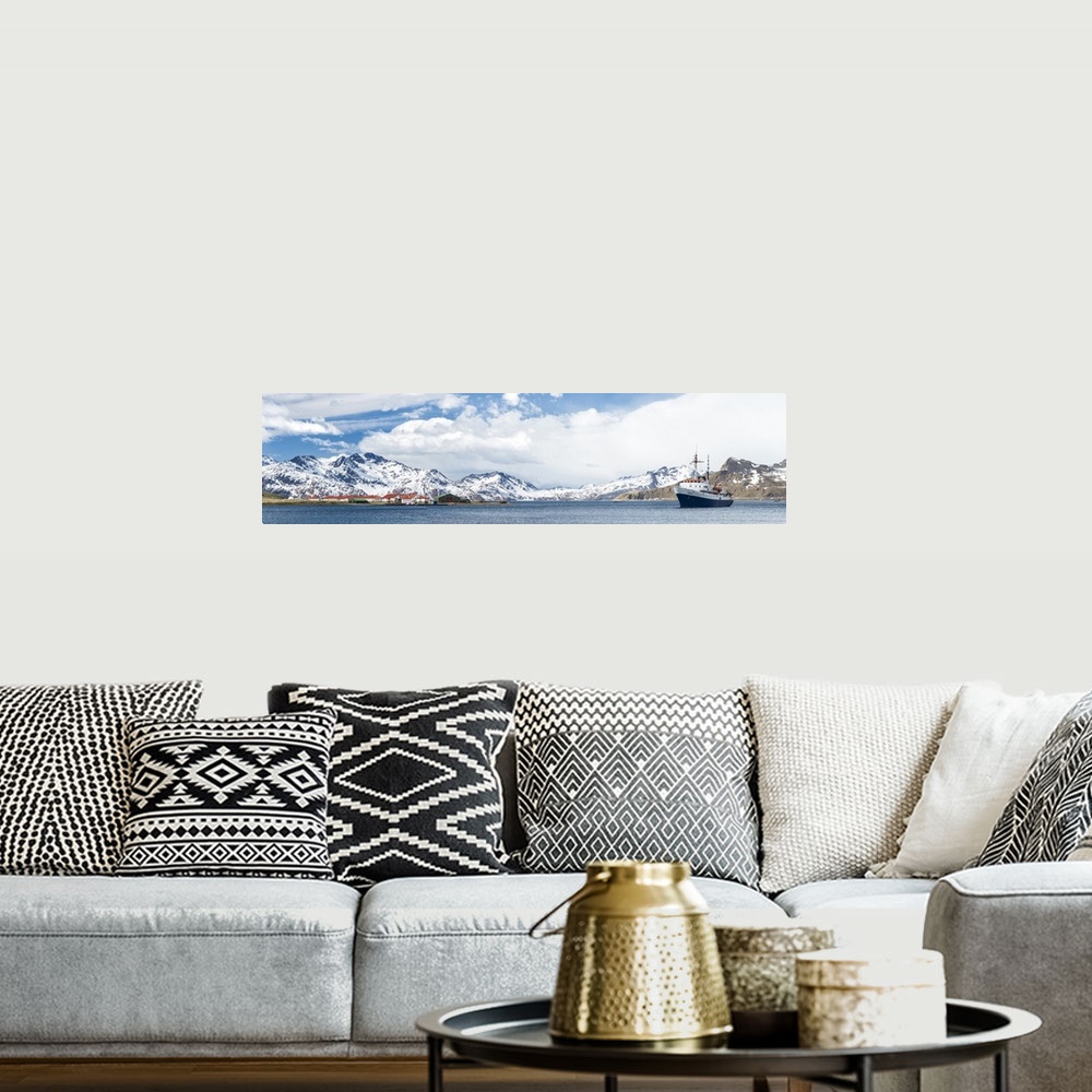 A bohemian room featuring MV Ushuaia tourist ship and the British base King Edward Point seen from Grytviken, South Georgia...