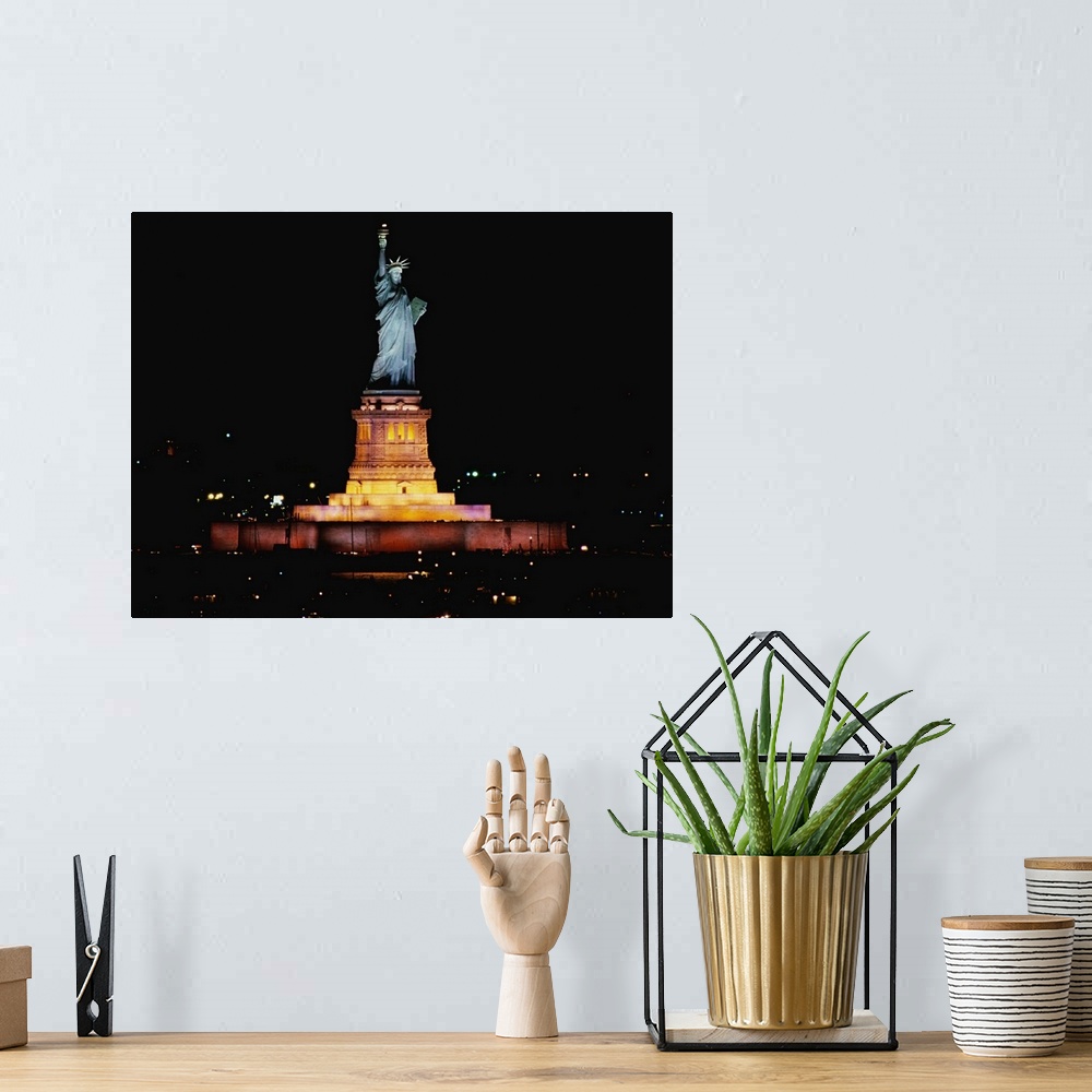 A bohemian room featuring Big photo on canvas of the Statue of Liberty at night lit up.