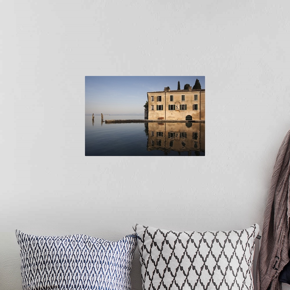 A bohemian room featuring Reflection of building in a lake, Punta San Vigilio, Lake Garda, Garda