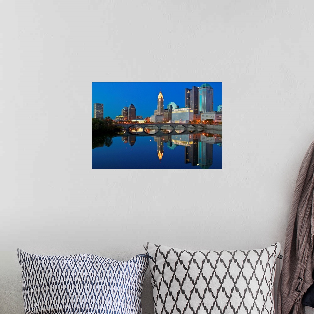 A bohemian room featuring Scioto River and Columbus Ohio skyline at dusk
