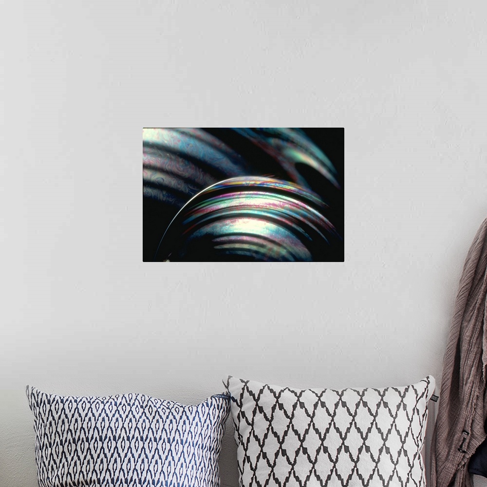 A bohemian room featuring This large piece shows a very close up shot of bubbles with an array of colors swirling throughout.
