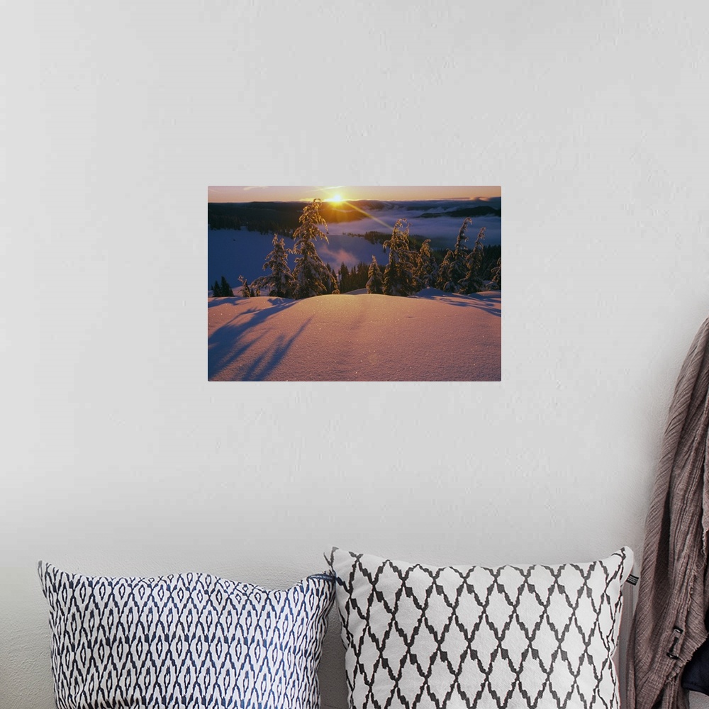 A bohemian room featuring This dramatic landscape photograph captures the sun ascending over the mountain ridge and illumin...