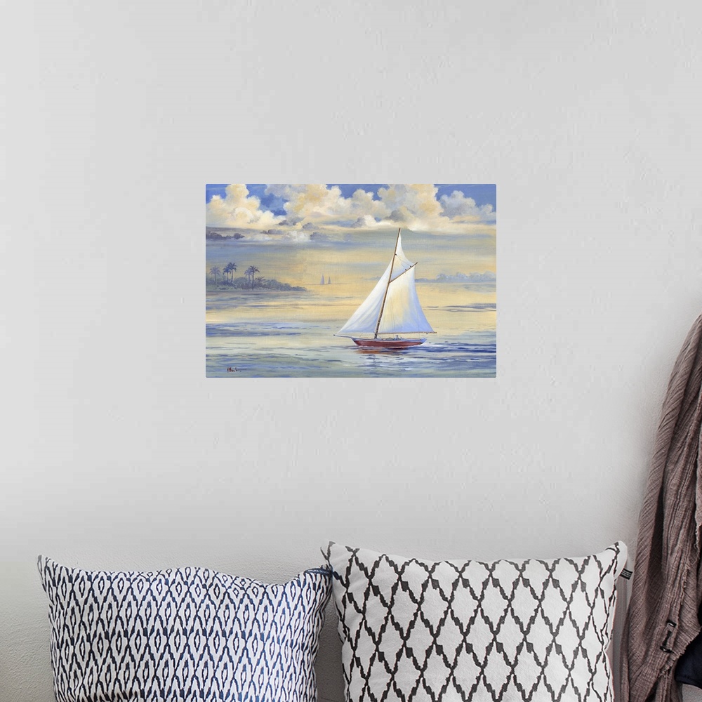 A bohemian room featuring Contemporary painting of a sailboat in the bay at sunrise with large clouds overhead.