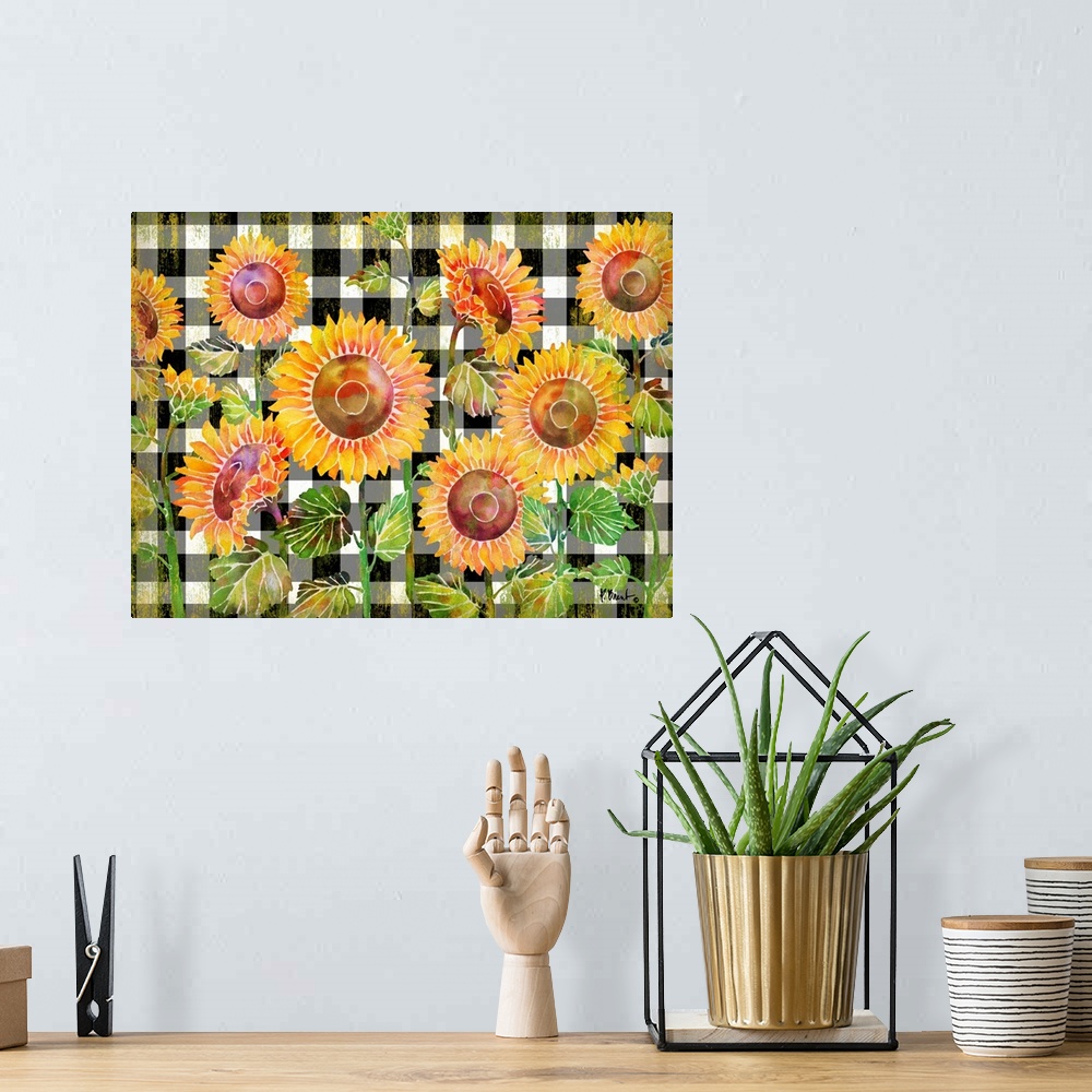 A bohemian room featuring Watercolor artwork of sunflowers on a black and white checked background.