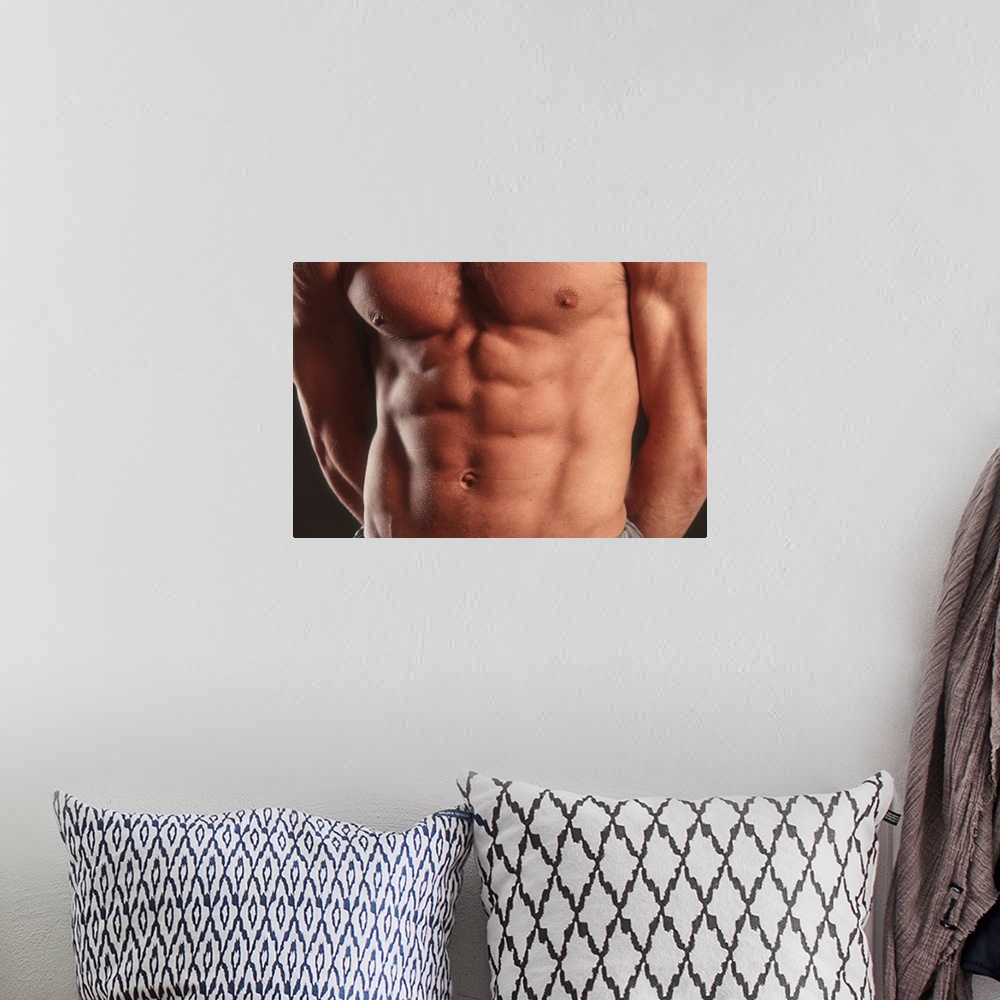 A bohemian room featuring Detail of male's torso.