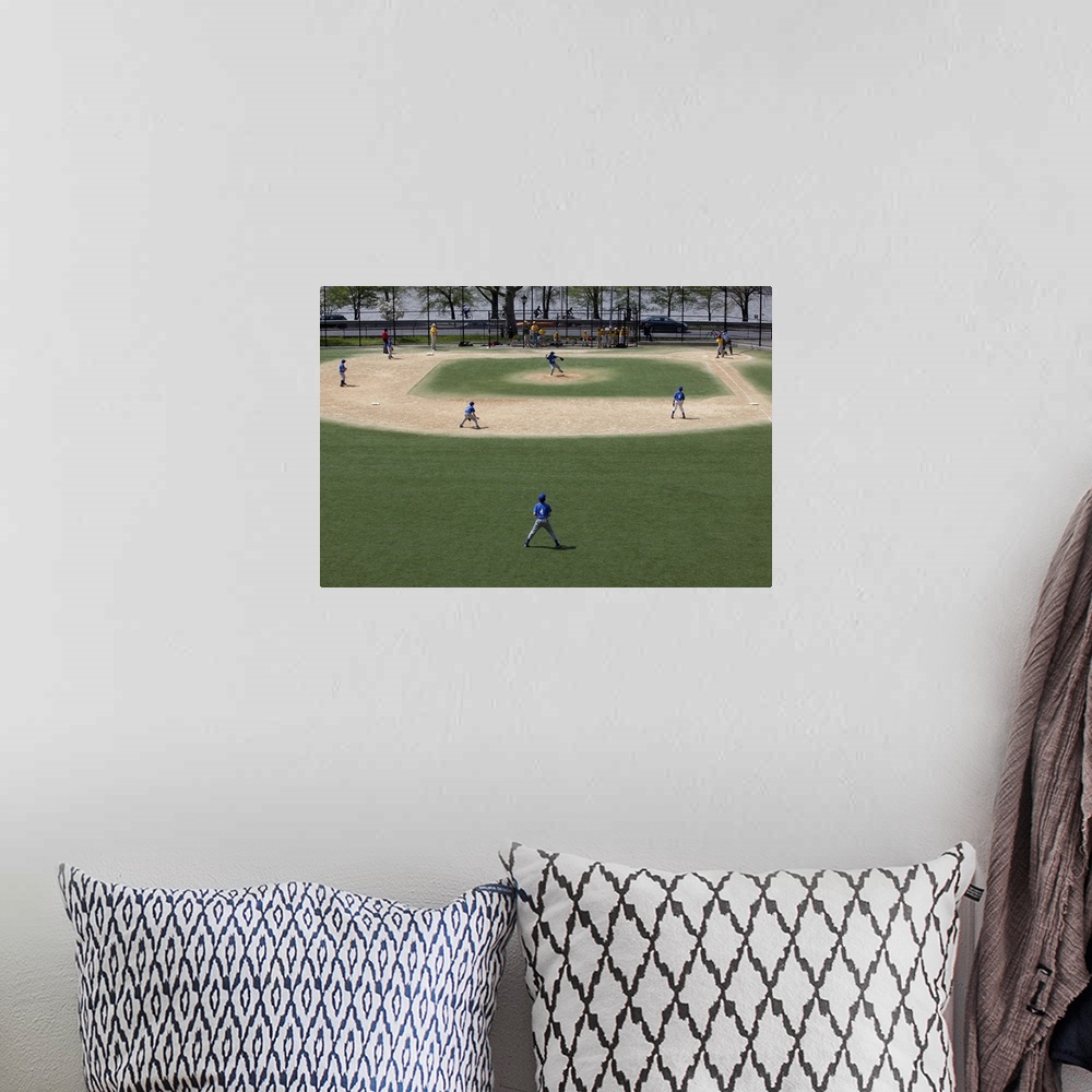 A bohemian room featuring Little league baseball field with game in progress