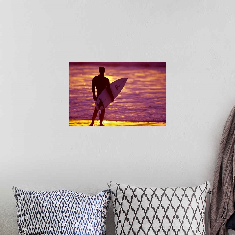 A bohemian room featuring Male surfer on the beach in San Diego, CA