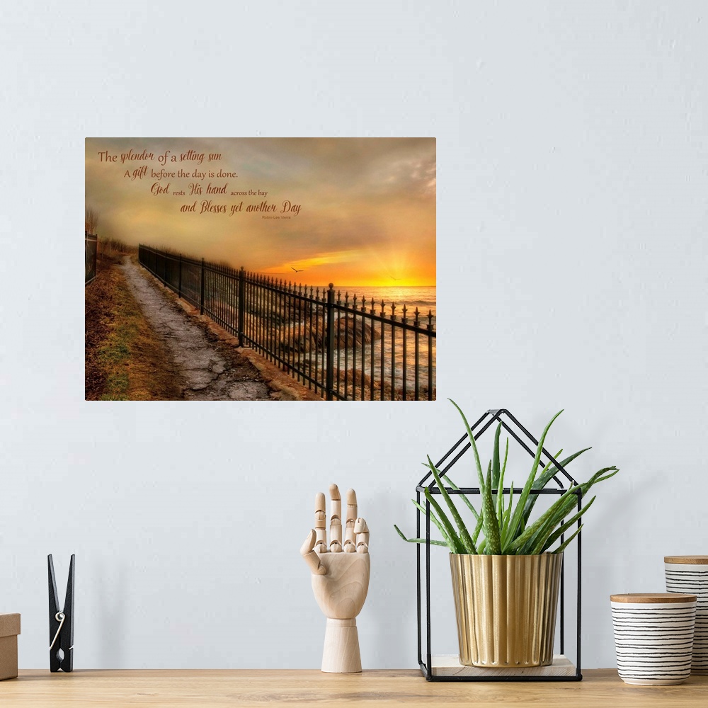 A bohemian room featuring A walkway with an iron fence along the coast, with a bible verse.