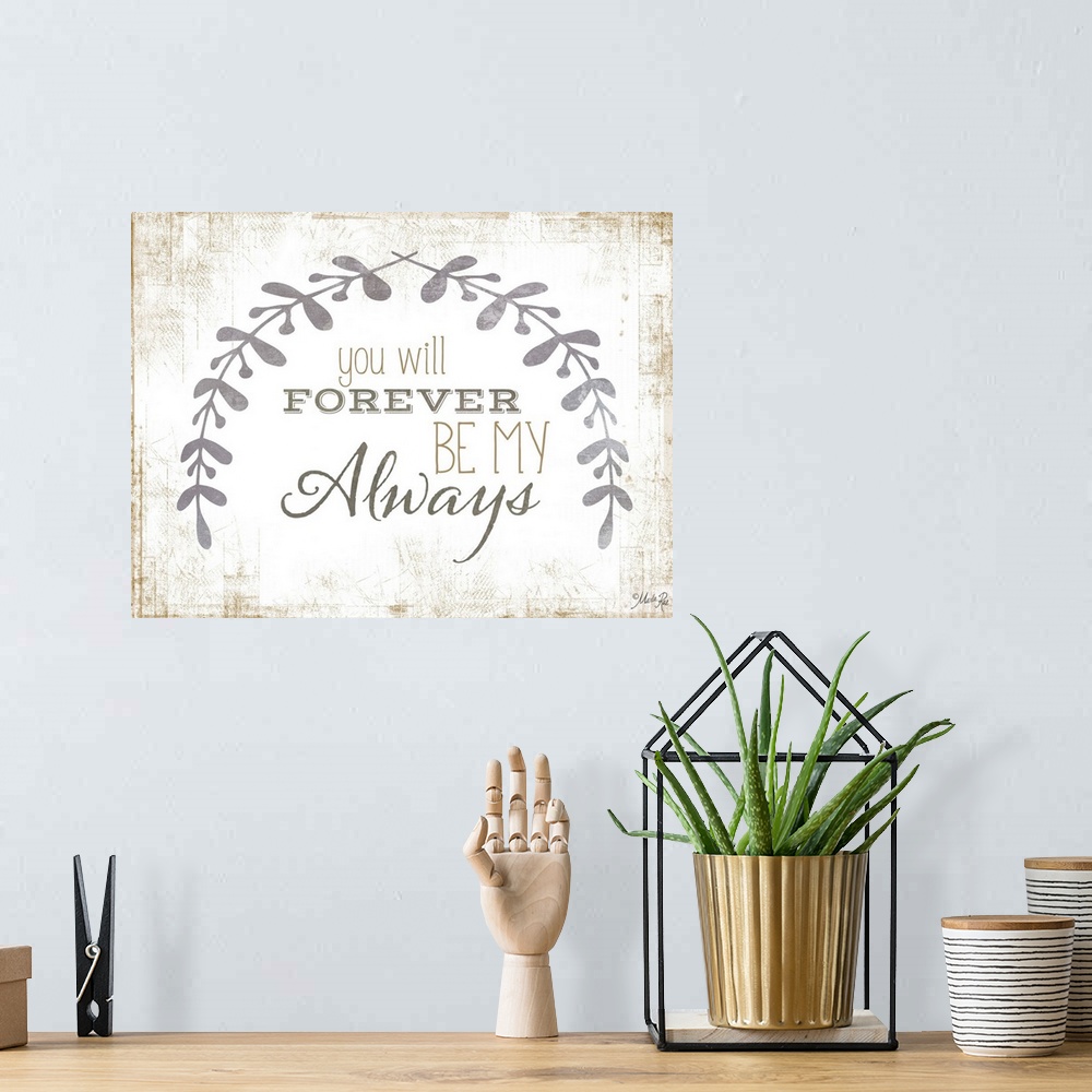A bohemian room featuring Message of love framed by two leafy sprigs on a textured background.