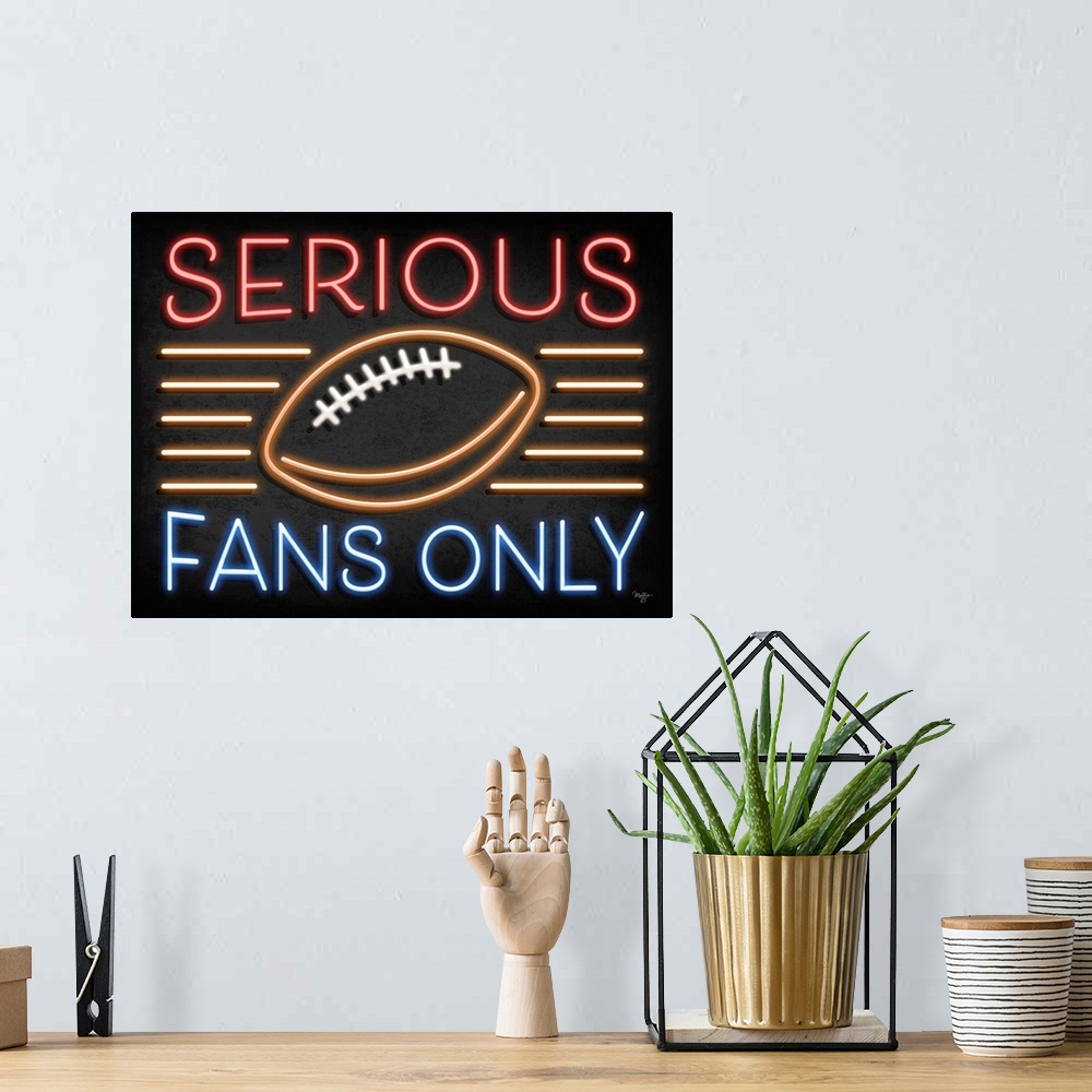 A bohemian room featuring Retro sign resembling neon lights which reads "Serious Fans Only."