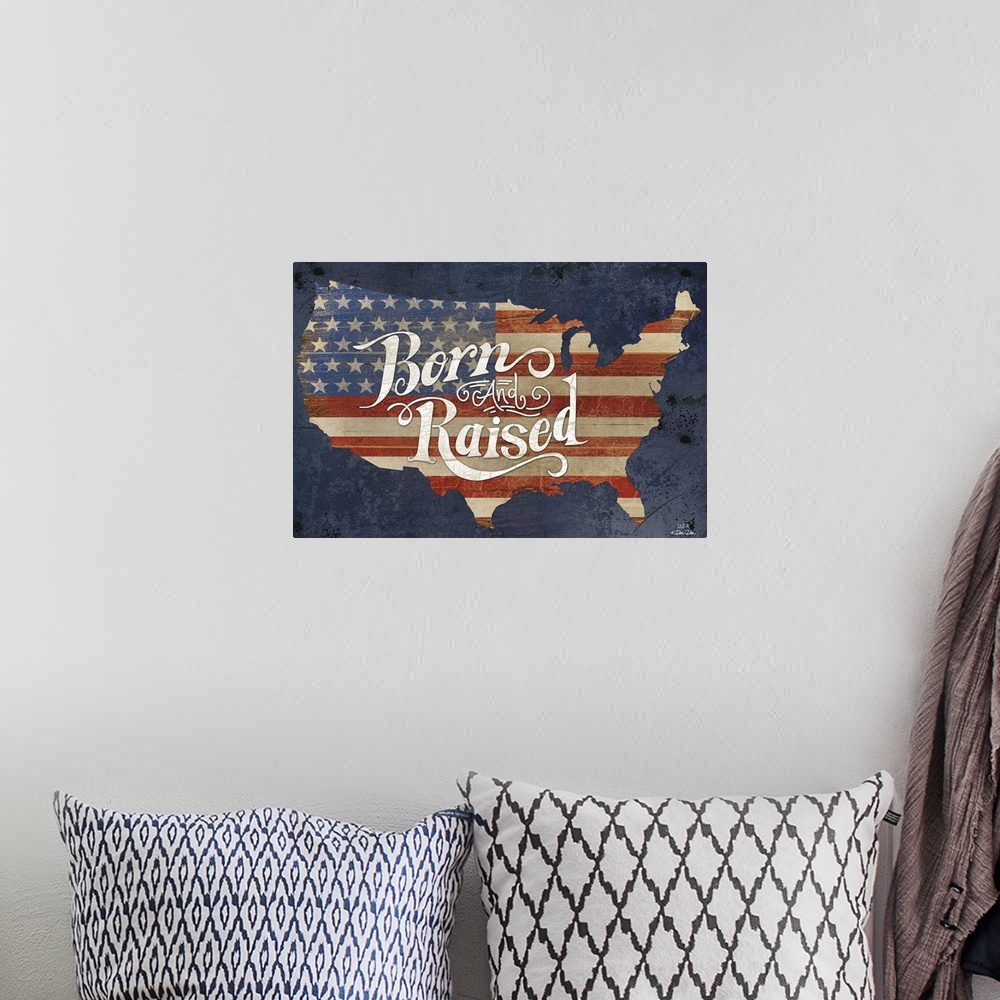 A bohemian room featuring The American flag in the shape of the United States with "Born and Raised" in decorative text.