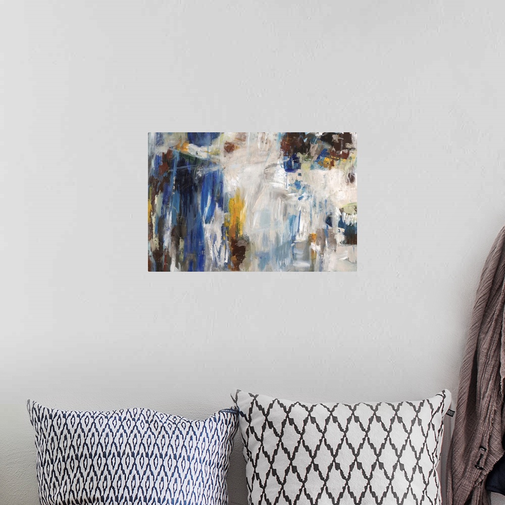 A bohemian room featuring Abstract contemporary artwork in white and blue, with golden pops of color.
