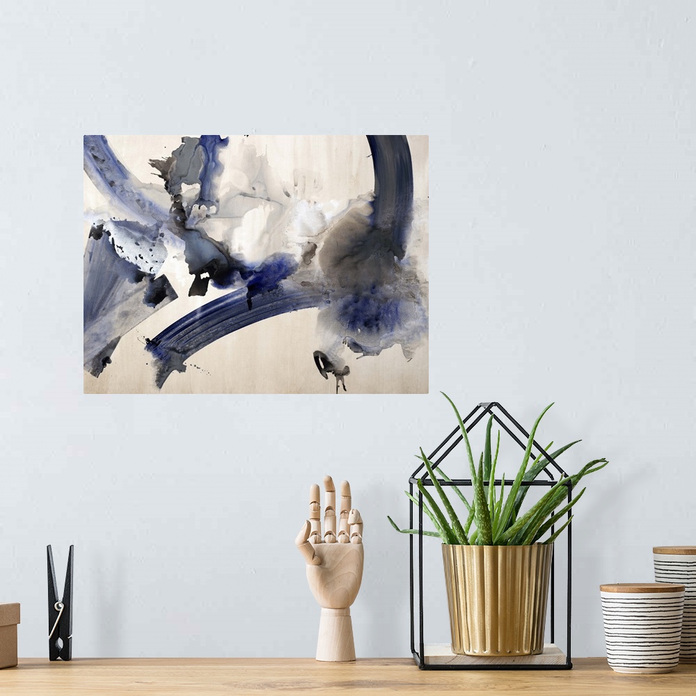 A bohemian room featuring Abstract watercolor painting with dark blue and black hues.