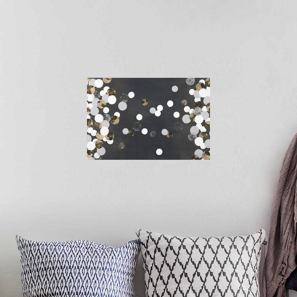 A bohemian room featuring Contemporary abstract painting with silver and white dots floating over a black space.