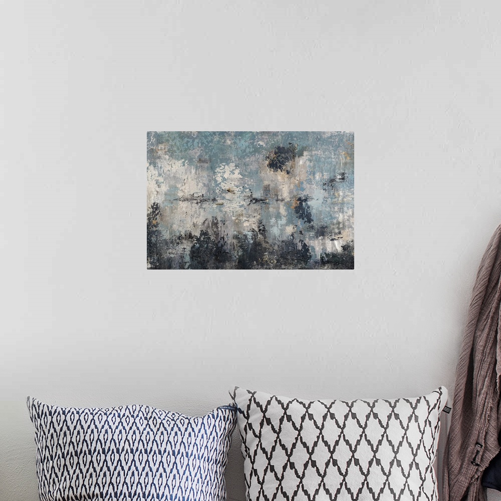 A bohemian room featuring Abstract painting using earth tones to create a grungy and rustic piece of art.