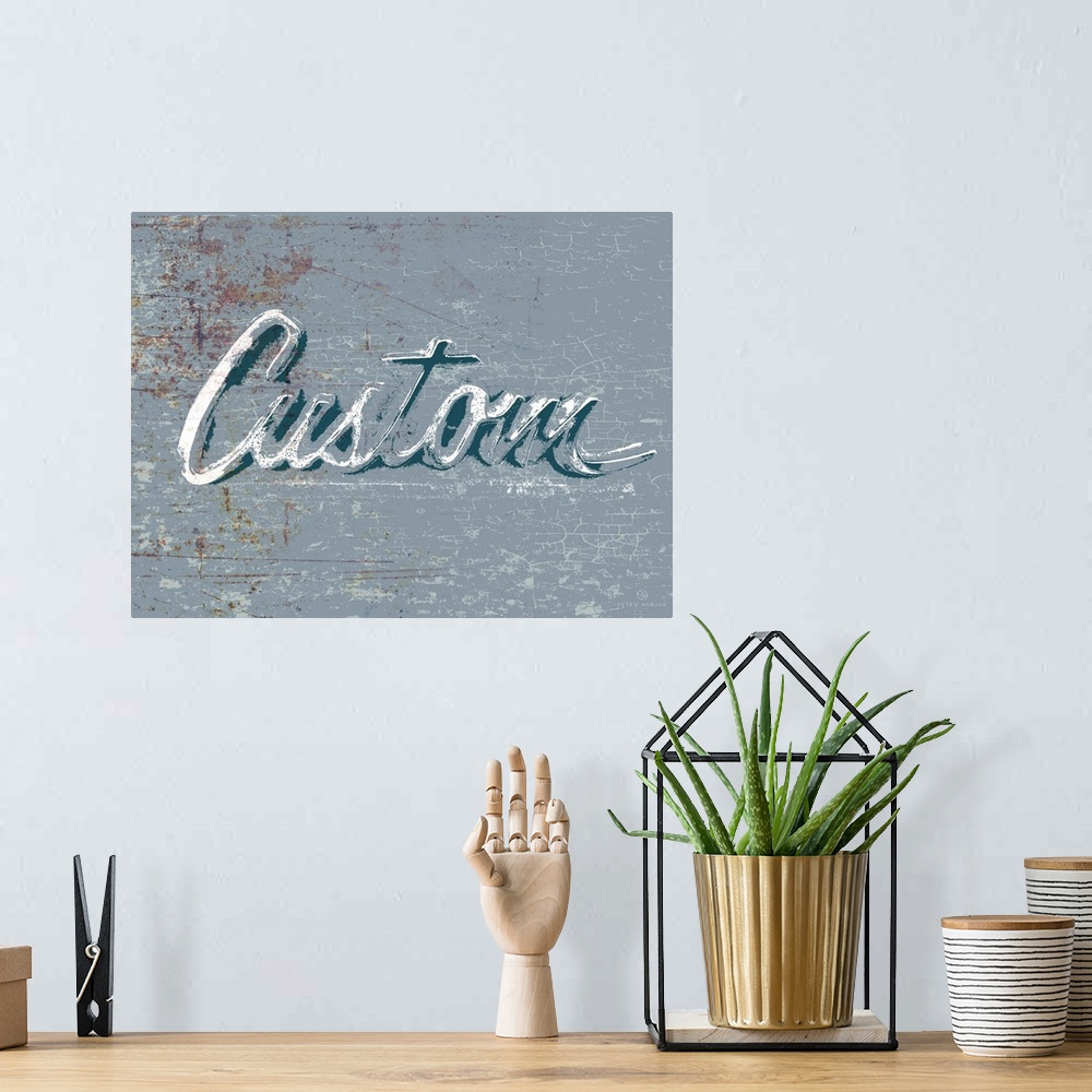 A bohemian room featuring Graphic rusty wall art of distressed typography with the the word Custom large and in center on a...