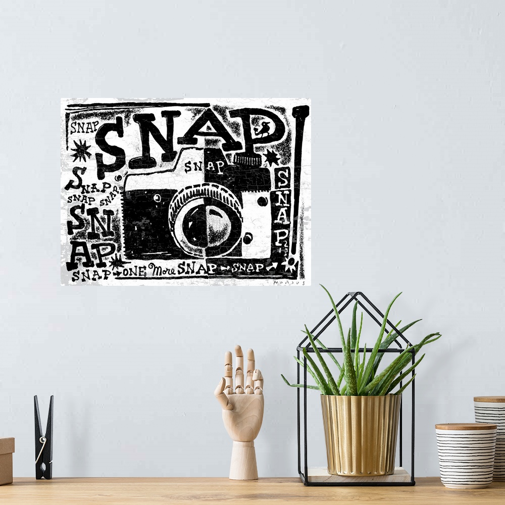 A bohemian room featuring Black and white stylized illustrated camera with the word “Snap!” repeated all over.