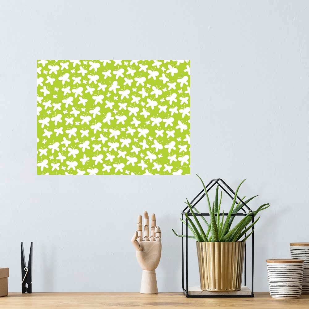 A bohemian room featuring Graphic repeat pattern of white butterflies on a green background.