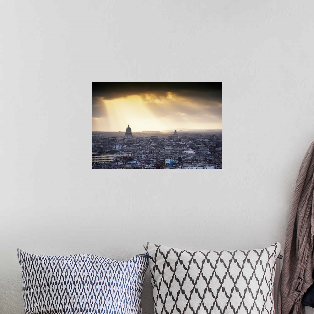 A bohemian room featuring Photograph of the sunrise over Havana, Cuba with large sun beams peering though the clouds and on...