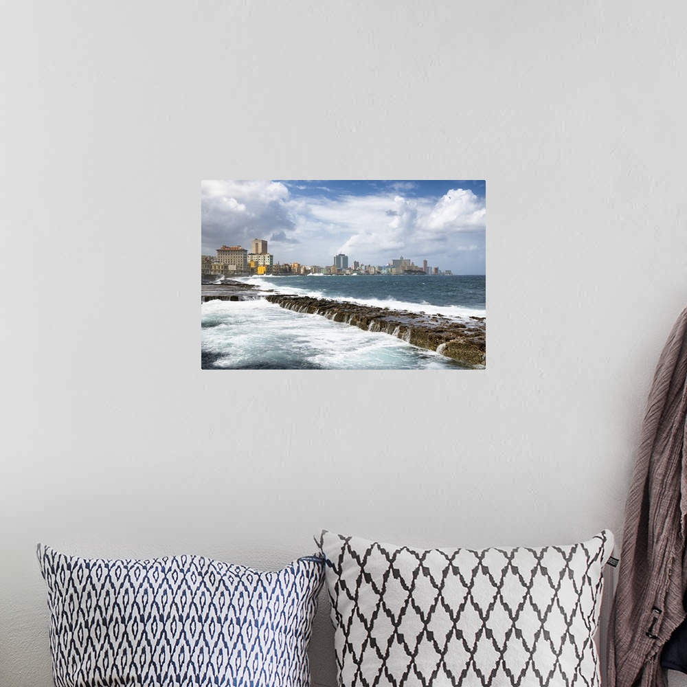 A bohemian room featuring Photograph of Malecon seawall with the city of Havana in the background.