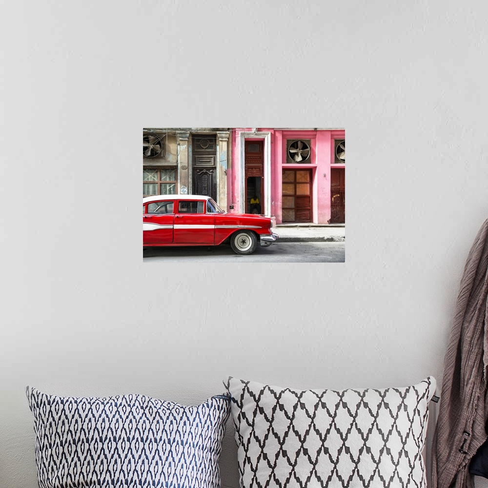 A bohemian room featuring Photograph of a classic old red car in front of a pink facade in Havana, Cuba.