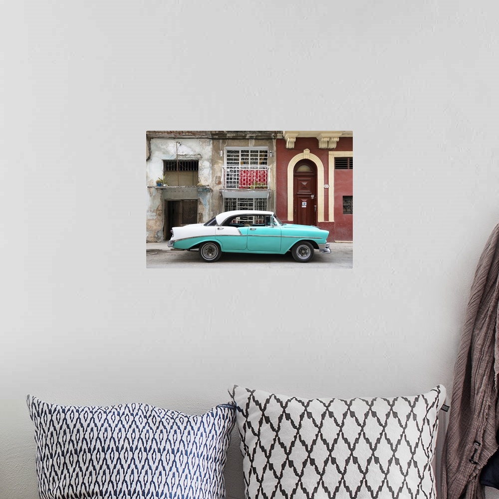 A bohemian room featuring Photograph of a turquoise and white vintage card parked on the side of a street in Havana with we...