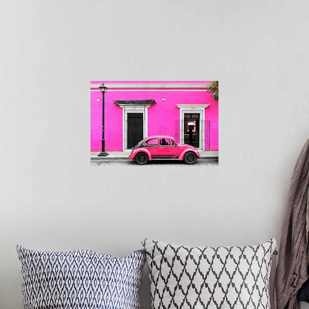 A bohemian room featuring Photograph of a classic pink Volkswagen Beetle in front of a pink building, Mexico. From the Viva...