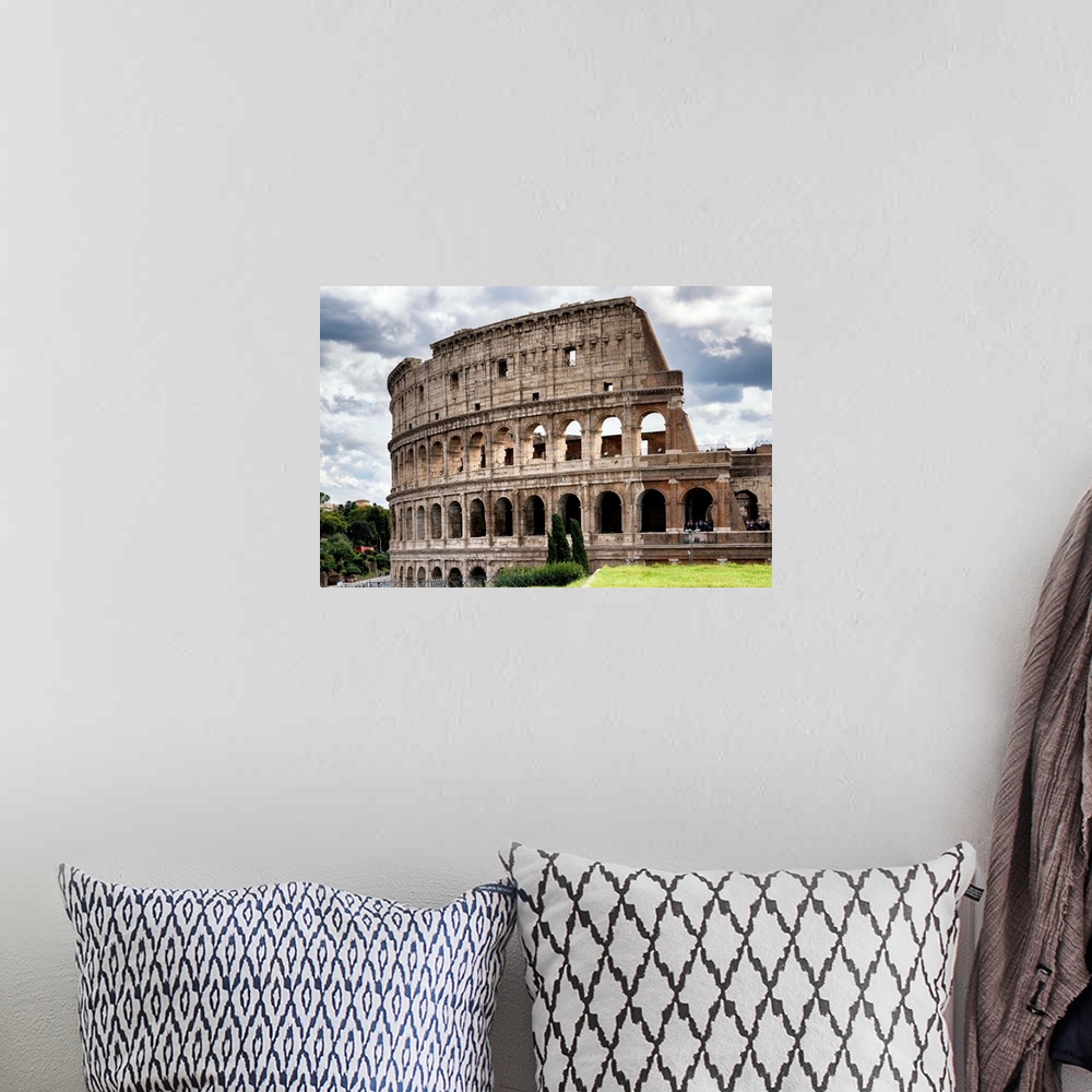 A bohemian room featuring It's a view of the Colosseum in the centre of the city of Rome, Italy.