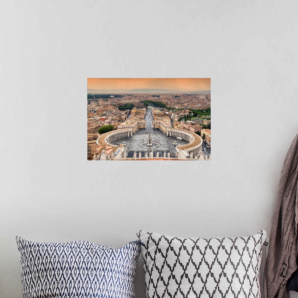 A bohemian room featuring It's a view of the Vatican City at sunset.