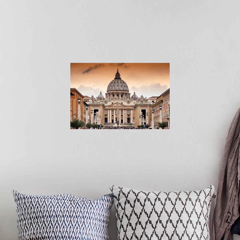 A bohemian room featuring It's St Peter's Basilica and St Paul's Cathedral at sunset in the Vatican City State.