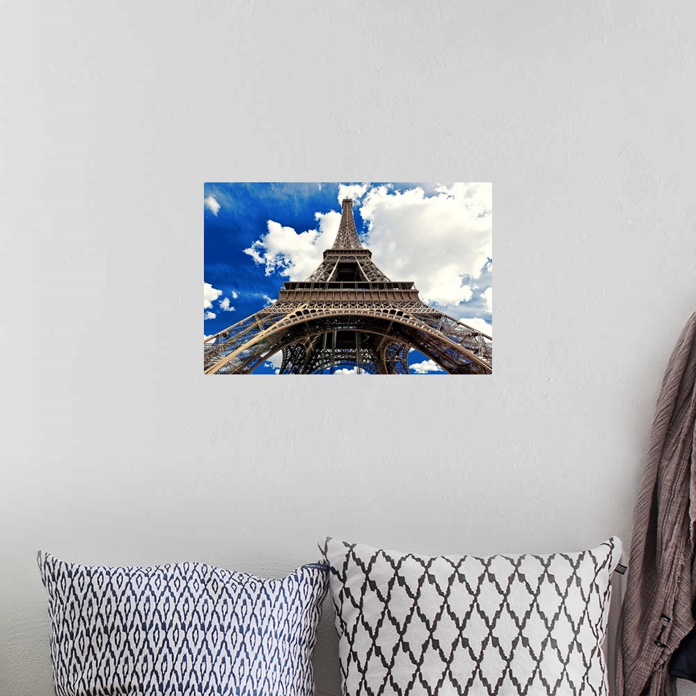 A bohemian room featuring Fine art photograph of the Eiffel Tower in France, looking up from the ground.