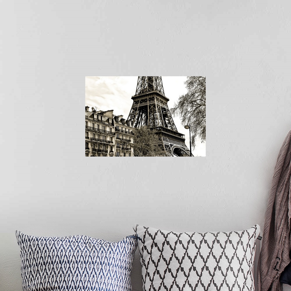 A bohemian room featuring Fine art photograph of the Eiffel Tower in France, with trees and buildings in the foreground.