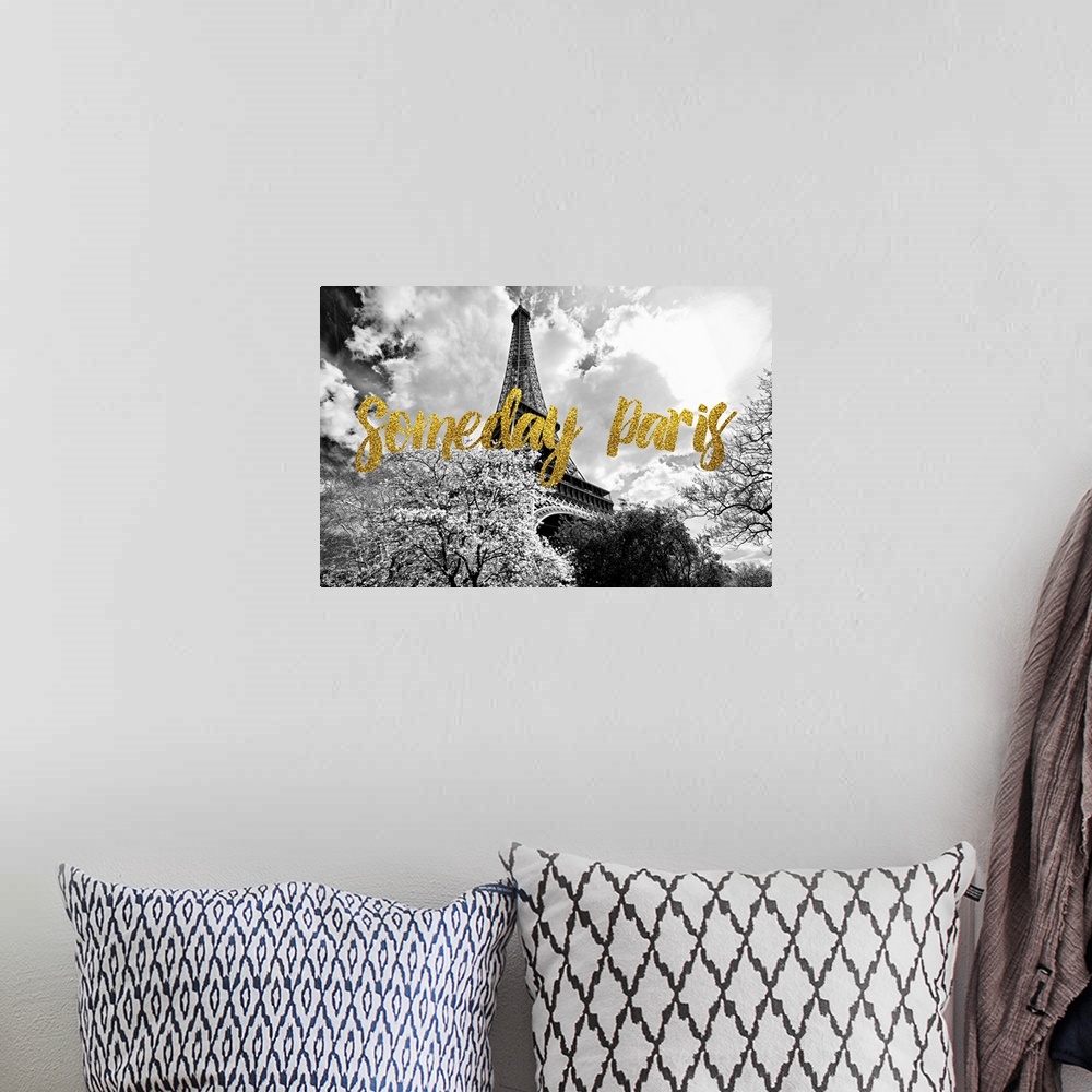 A bohemian room featuring Black and white photograph of the Eiffel Tower surrounded by treetops with the phrase "Someday Pa...