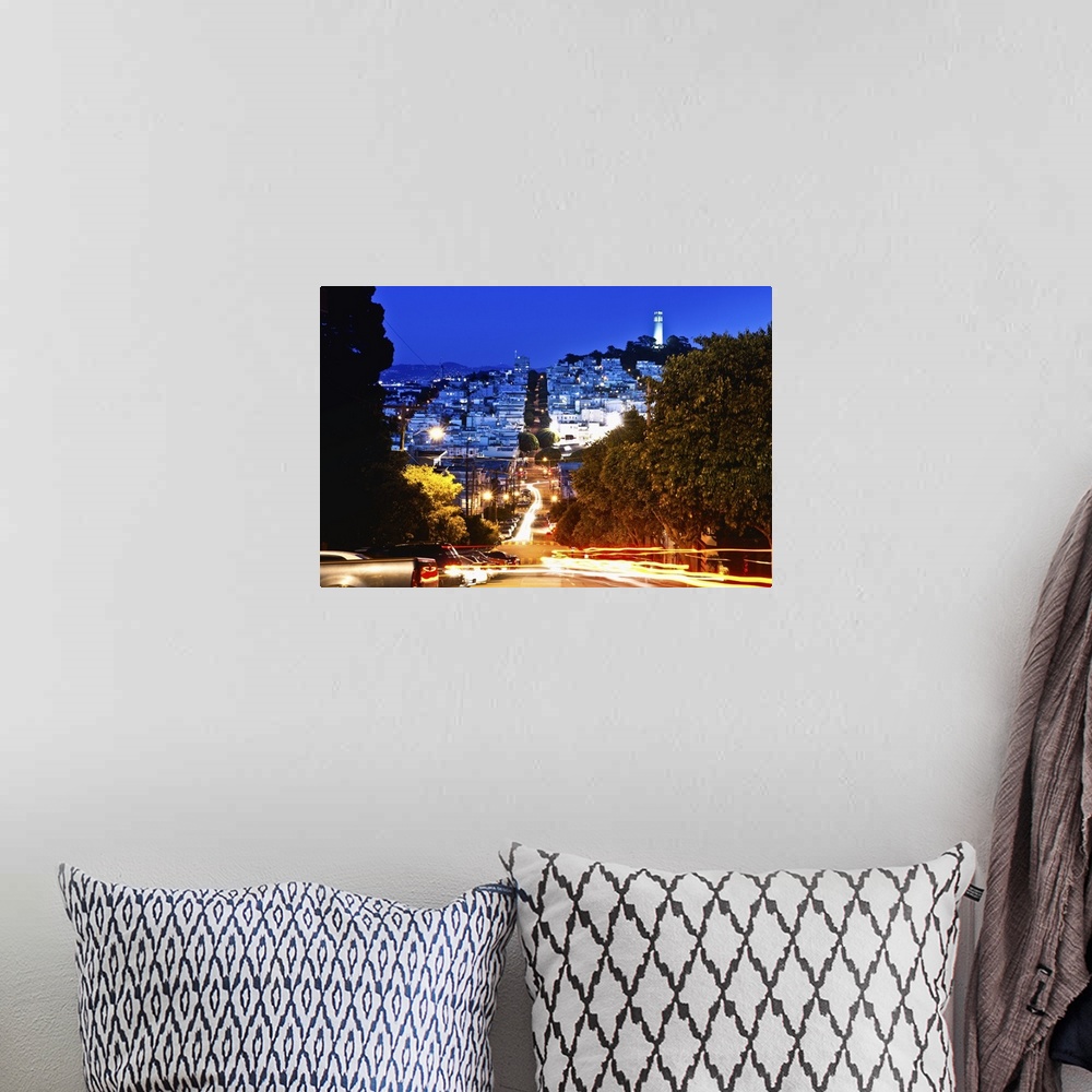 A bohemian room featuring A time lapse photo of the street famous for its hairpin turns in the evening.