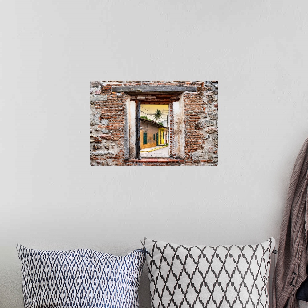 A bohemian room featuring View of a street scene in Mexico framed through a stony, brick window. From the Viva Mexico Windo...