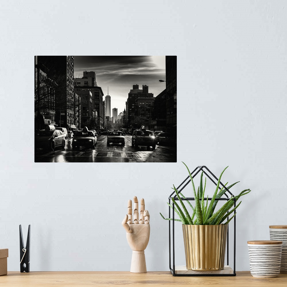 A bohemian room featuring A black and white photograph of New York city at night with yellow taxis everywhere.