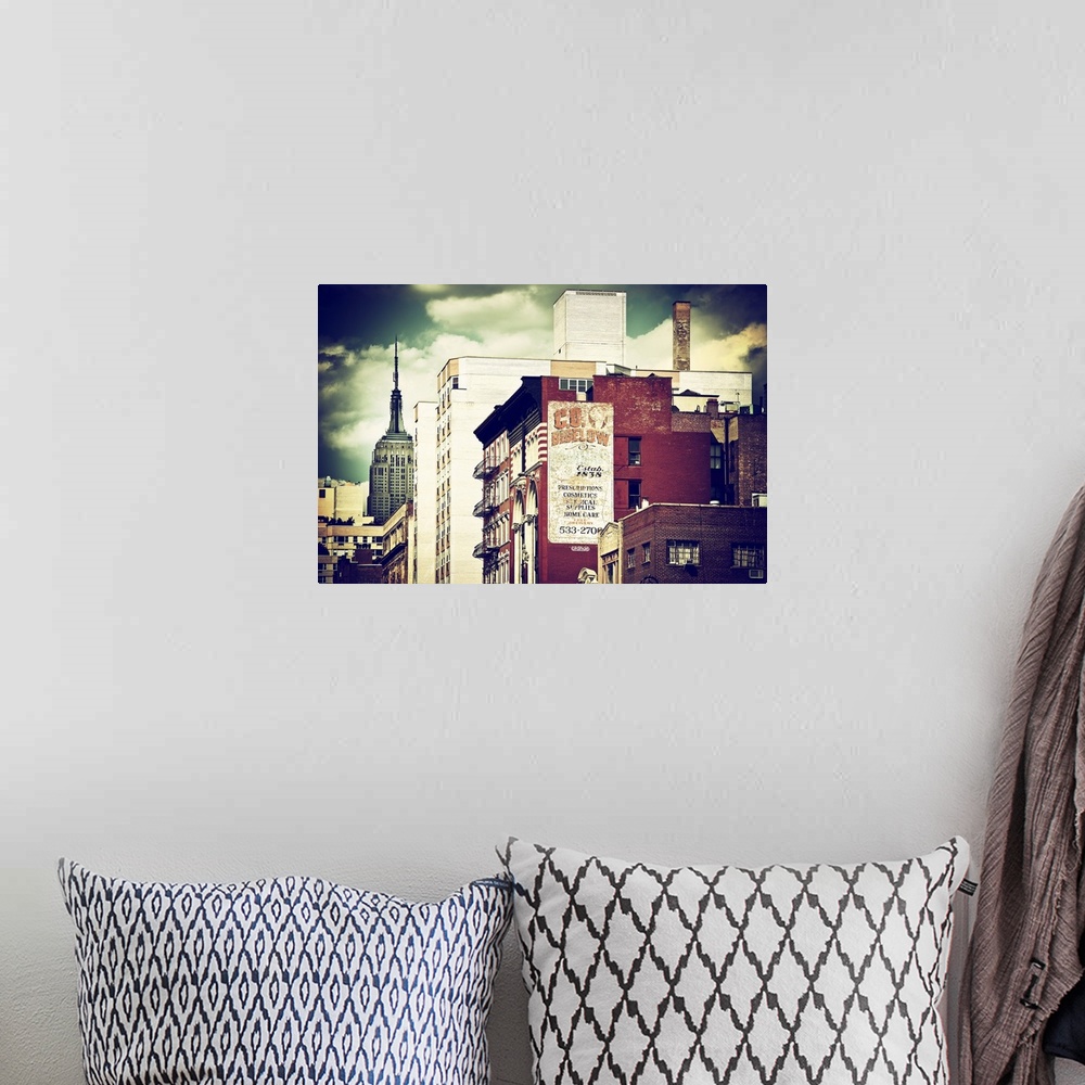 A bohemian room featuring Vintage style photo showing the sides of New York buildings.