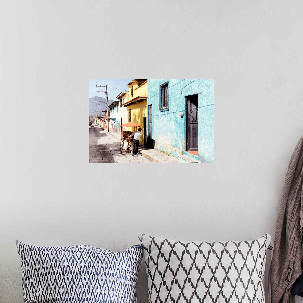 A bohemian room featuring Photograph of a street vendor pushing his cart full of fresh fruit down a colorful street in Mexi...