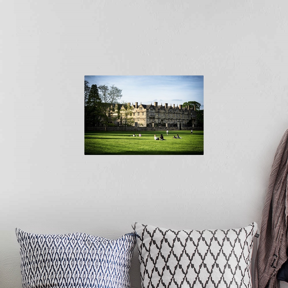 A bohemian room featuring Fine art photo of students on the lawn at the University of Oxford.