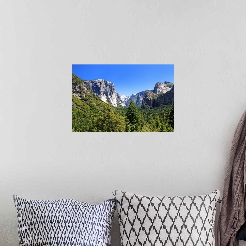 A bohemian room featuring The majestic peaks of Half Dome and its neighboring mountains over the forests of Yosemite Nation...