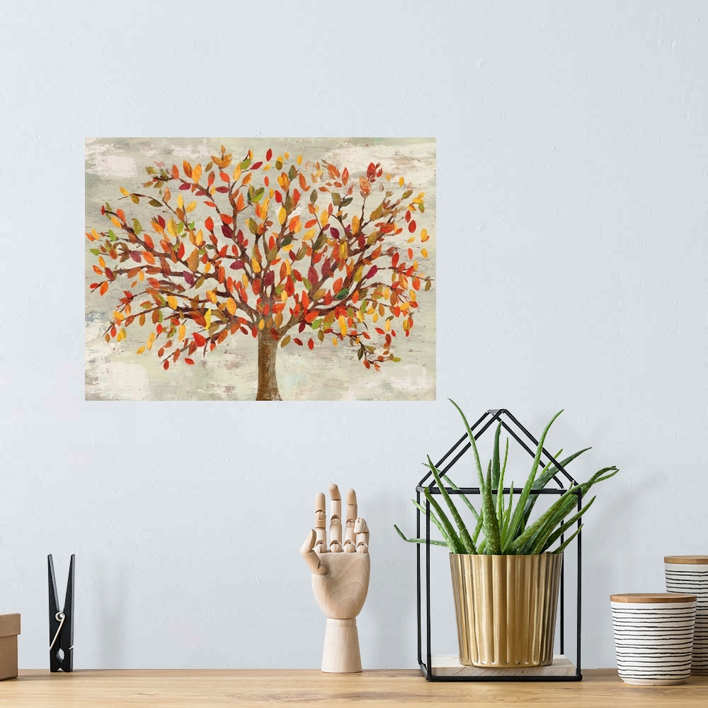 A bohemian room featuring Artwork of a tree with leaves in autumn colors.