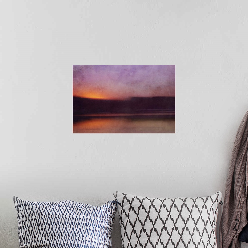 A bohemian room featuring Photograph of a cove surrounded by silhouetted land forms with a sunset illuminating the sky in p...